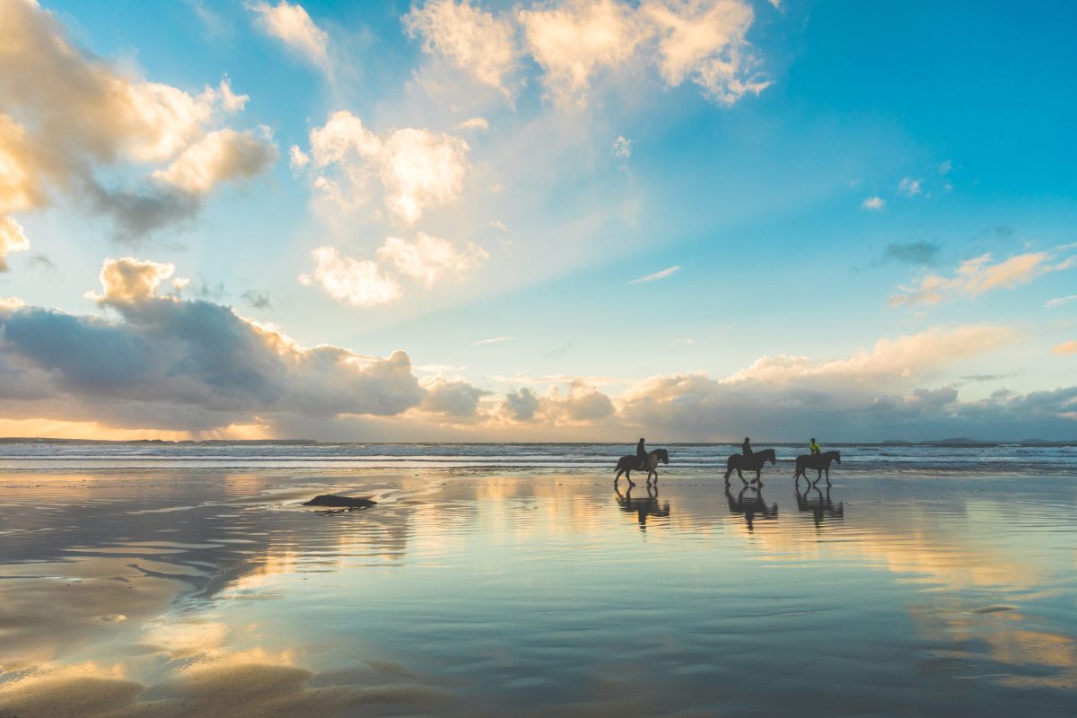 Horse riders on the beach in North Norfolk beach